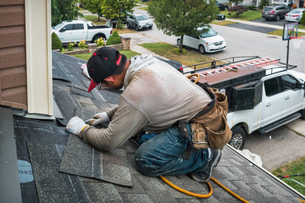 Professional Roofing technician working in Greenville, MI